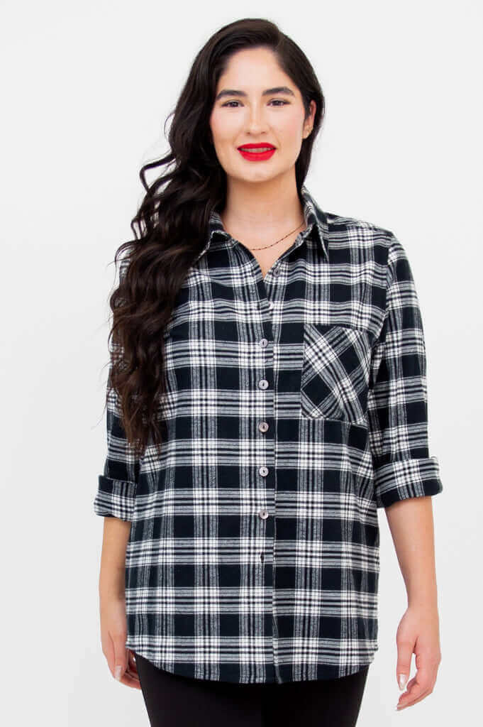Front view of model wearing Georgia black and white plaid button-up shirt