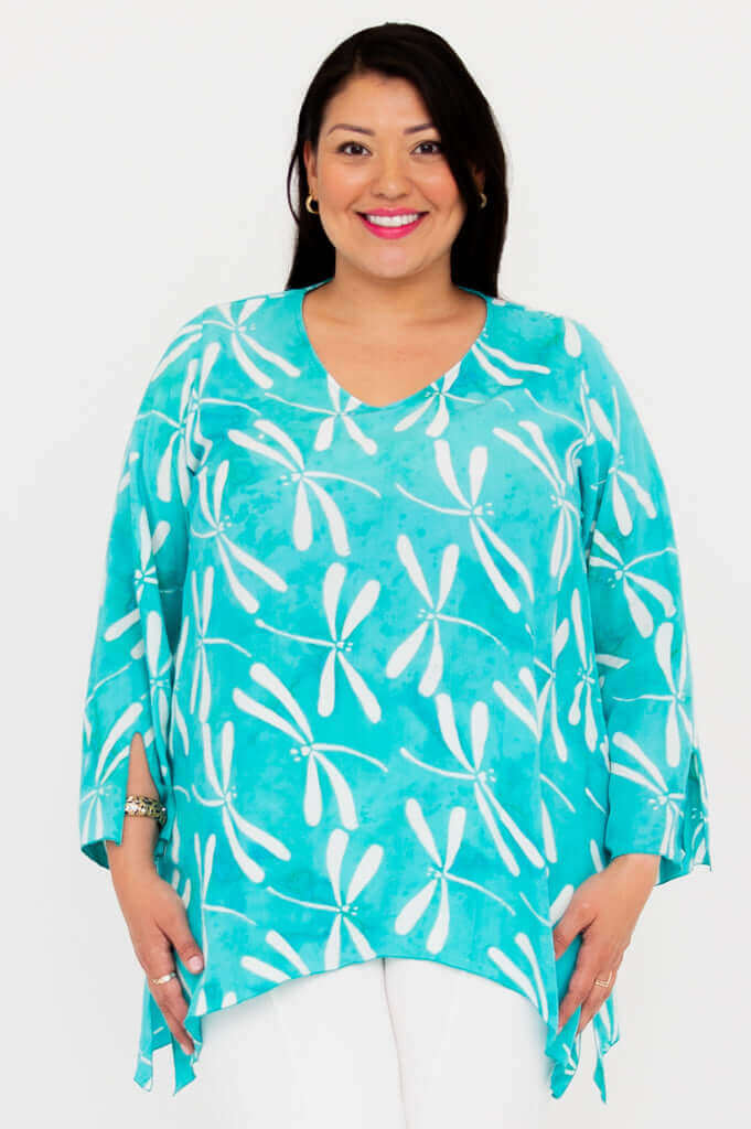 Front view of model wearing aqua blue dragonfly print flowy boho top