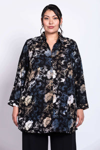 Front view of model wearing black floral batik print tunic shirt