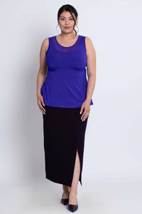 Front view of model wearing purple mesh detail tank top with black slit skirt