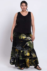 Front view of model wearing the Tibby summer skirt in abstract black and yellow print