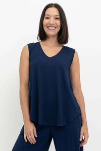 Front view of a woman wearing a navy blue sleeveless V-neck bamboo top