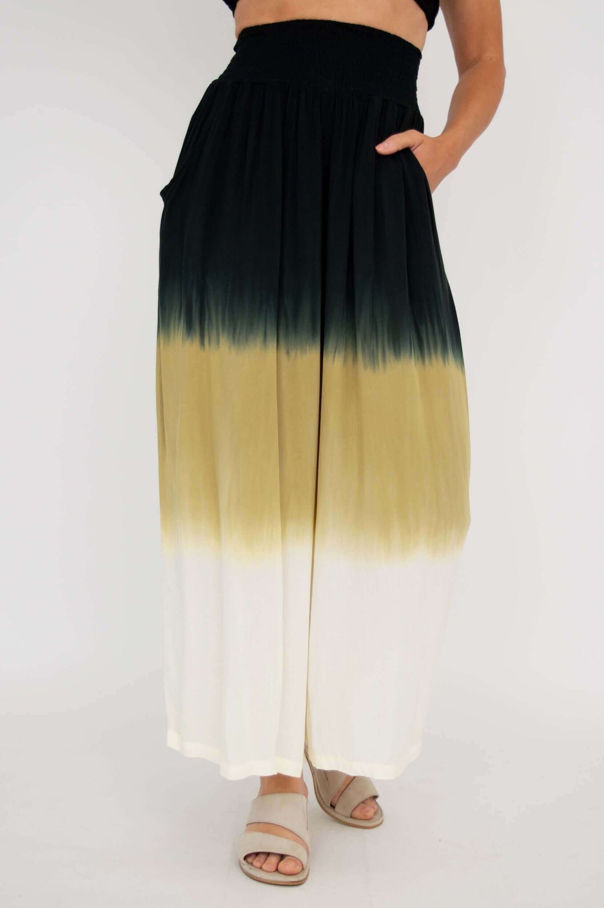 Front view of wide-leg pants with black, tan, and white ombre design