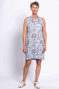 Front view of a woman wearing a sleeveless paisley print shift dress with split neckline