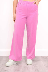 Front view of pink corduroy wide-leg pants with elastic waistband and pockets