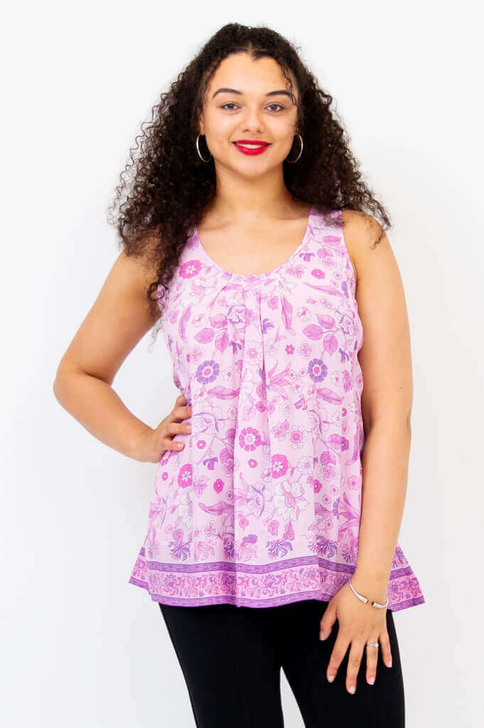 Front view of model wearing pink floral pleated tank top