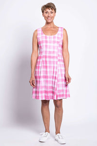 Front view of a woman wearing a sleeveless pink plaid A-line dress with scoop neckline