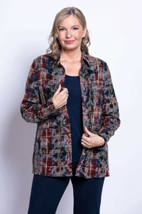 Close up front view of a woman wearing a multi plaid cotton shirt collar jacket over a navy top.