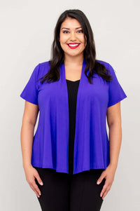 Front view of model wearing a purple short sleeve open jacket over a black top