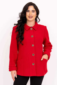 Front view of woman wearing a red wool blend coat with bronze buttons and pockets