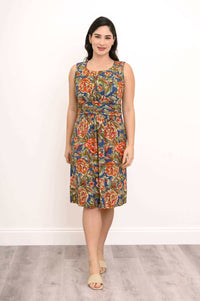 Front view of a model wearing a sleeveless floral knee-length dress
