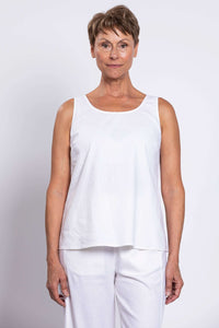 Front view of woman wearing a white sleeveless linen blend tank top