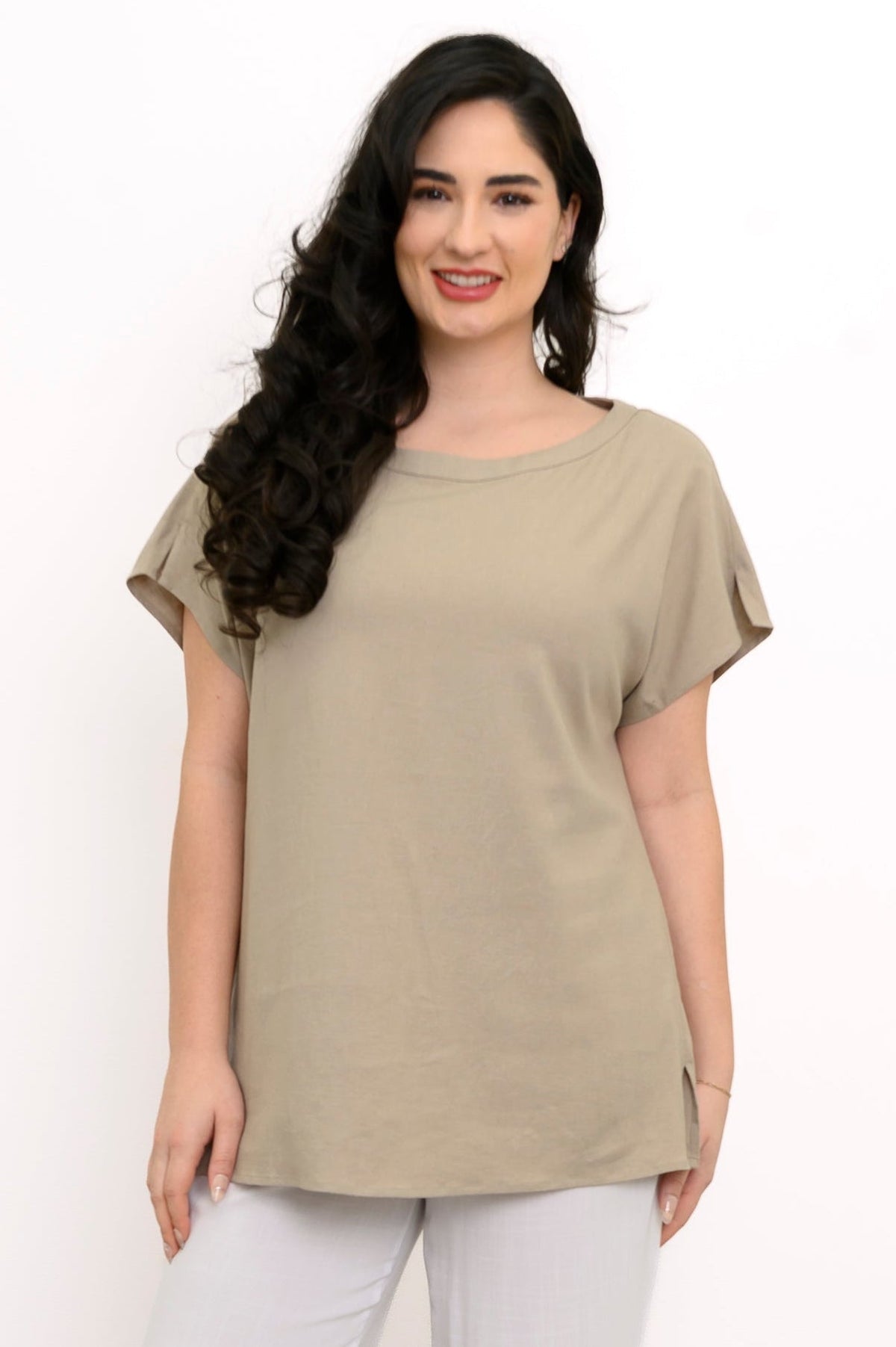 Front view of woman in beige dolman sleeve tee with boatneck