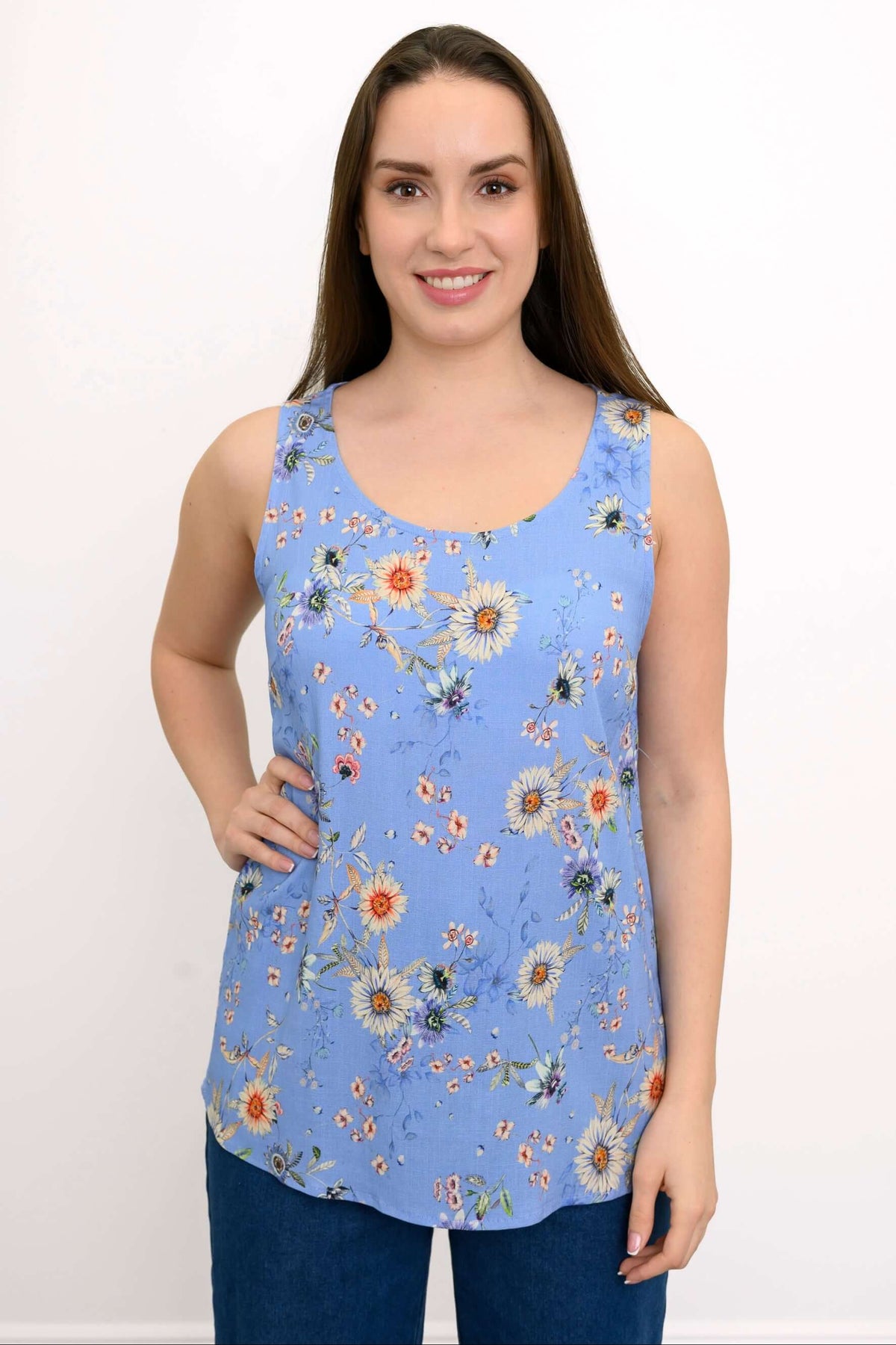 Front view of woman wearing a blue floral sleeveless tank top