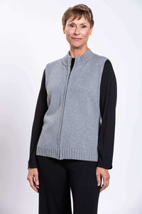 Front view of a woman wearing a gray zip-up cotton vest with ribbed trim and black sleeves