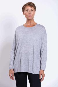 Front view of woman wearing a light grey long sleeve merino pullover sweater