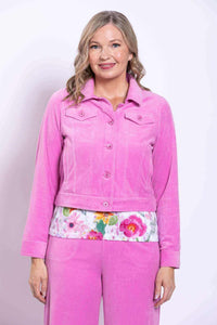 Front view of woman wearing a pink corduroy jacket and matching pants