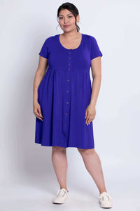 Front view of a woman wearing a short sleeve royal blue button-down dress