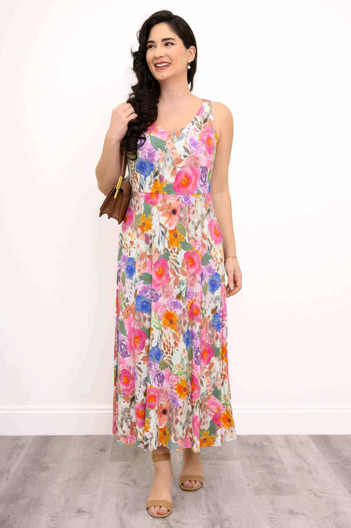 Front view of woman wearing a sleeveless floral maxi dress with a fitted bodice