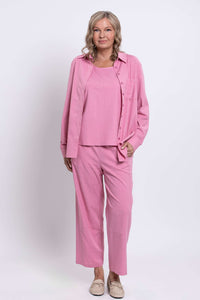 Front view of woman modeling pink linen-blend shirt and wide-leg pants
