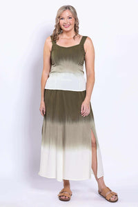 Front view of woman wearing olive ombre maxi skirt with side slits