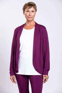 Front view of woman wearing plum purple French Terry jacket and white top