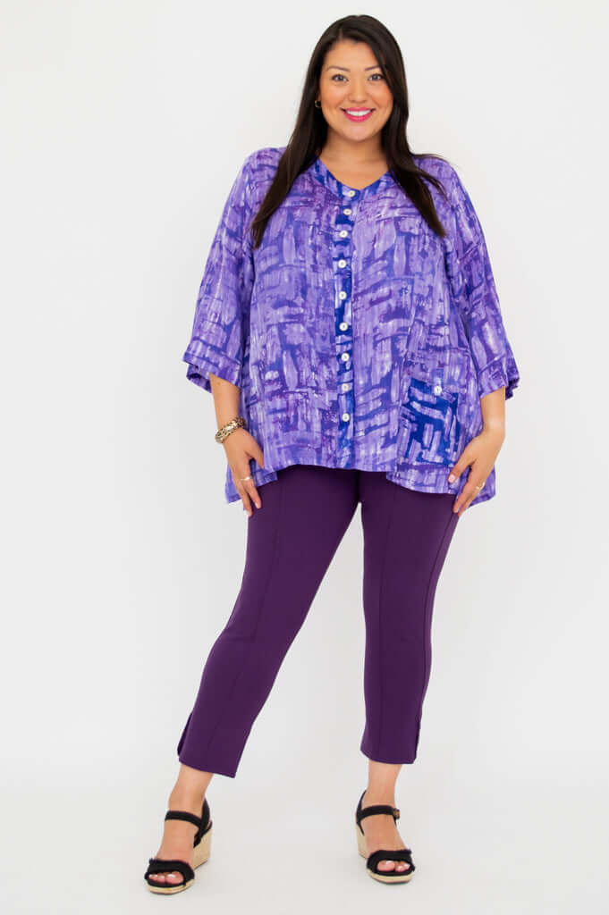 Full-length view of model in purple button-front tunic top and matching pants