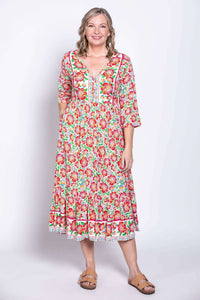 Model standing in floral batik midi dress viewed from front