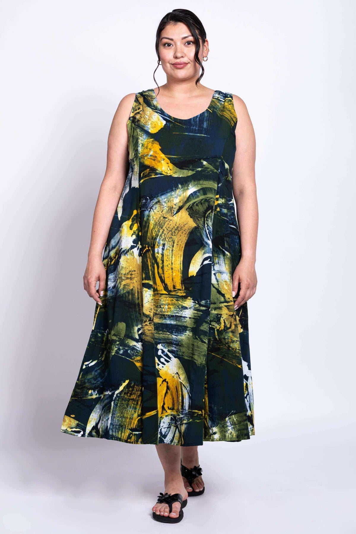 Model facing forward in full-length Sara dress with bold artistic pattern and A-line shape