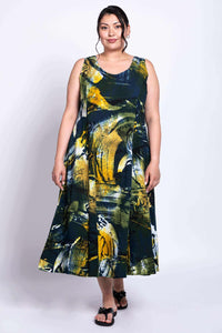 Model facing forward in full-length Sara dress with bold artistic pattern and A-line shape