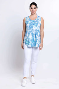 Full body view of woman in blue watercolour tank top and white pants