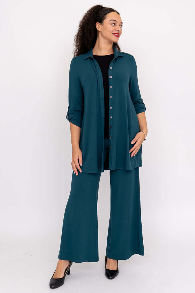 Full body view of model in teal Michele bamboo French terry blouse-jacket and matching pants