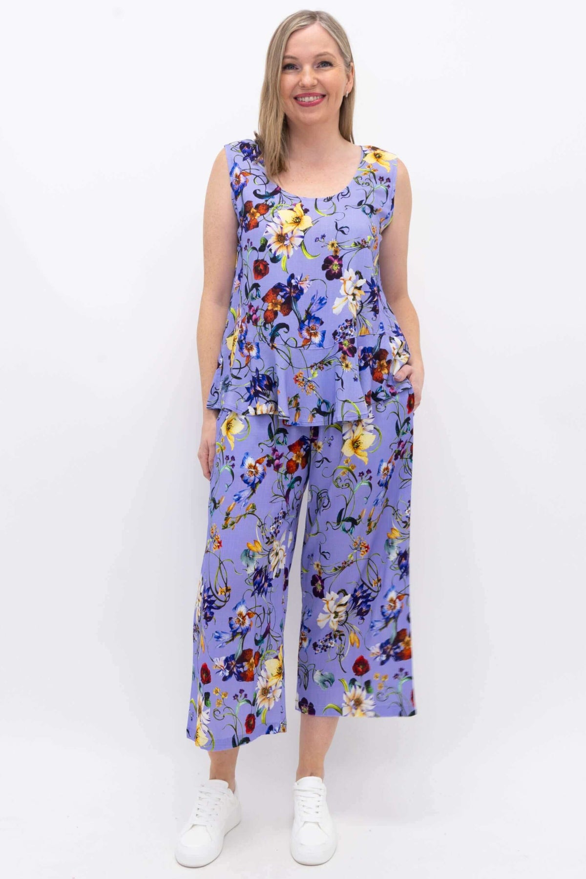 Full body front view of model in Ginny Tank and matching lavender floral pants