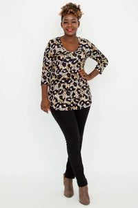 Full body front view of woman in Jackie V-Neck Leopard Top and black skinny pants