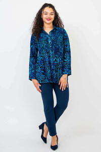 Full body front view of model in Cindy smocked blue swirl shirt and navy pants