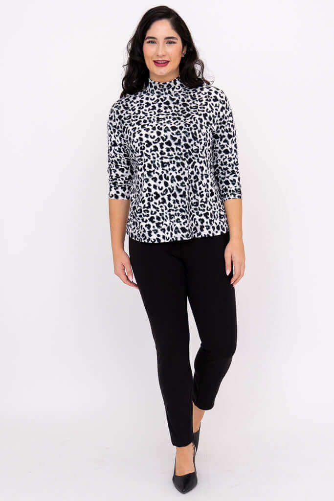 Full body front view of model in animal print Highdrop Top and black pants