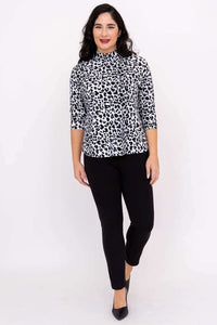 Full body front view of model in animal print Highdrop Top and black pants