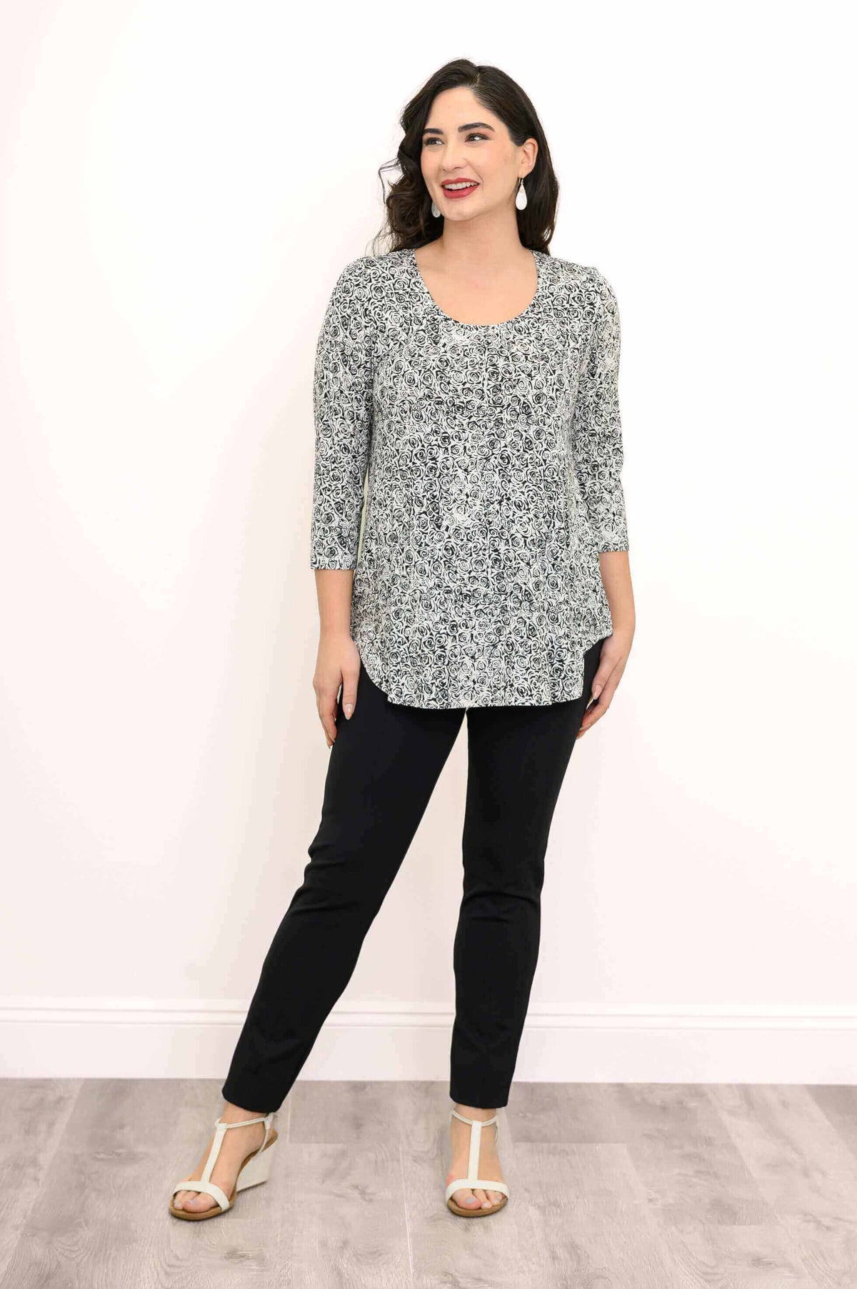 Full body front view of woman in jazz bamboo top and black pants