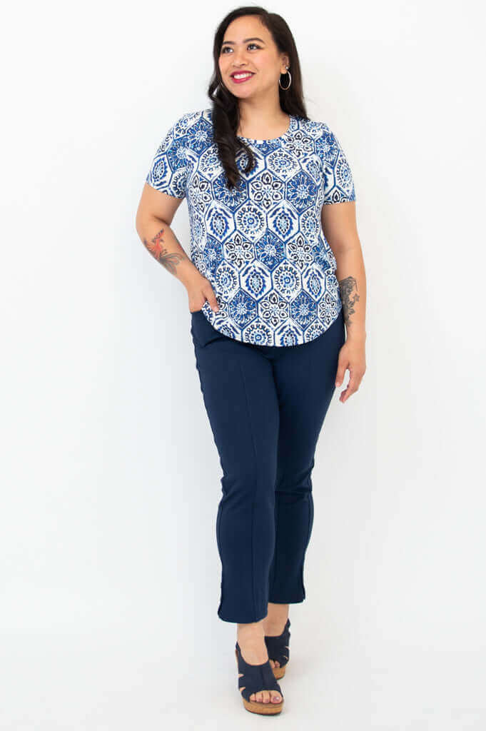 Full body front view of woman in Tessa Tee Indigo Mosaic and navy pants