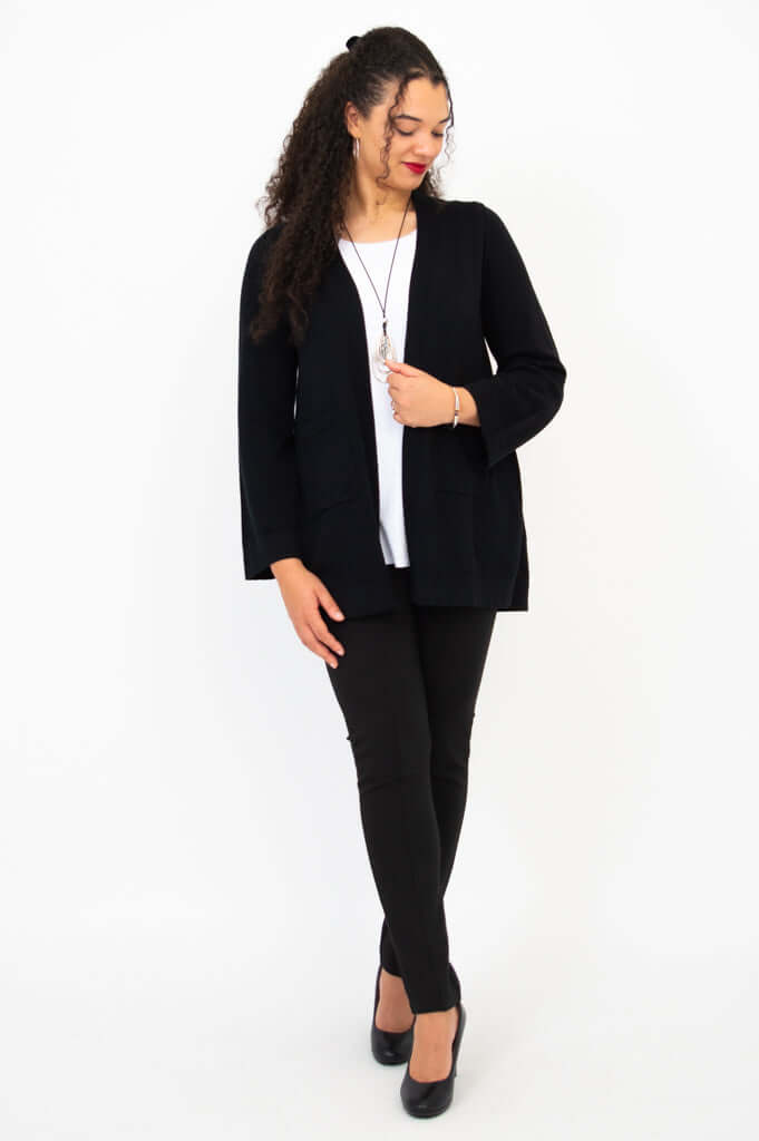 Full body view of model in black Dallas Cardigan, white top, and black pants