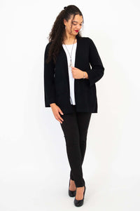 Full body view of model in black Dallas Cardigan, white top, and black pants