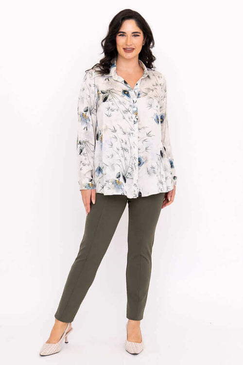 Full body front view of woman modeling Charlotte Blouse and green pants