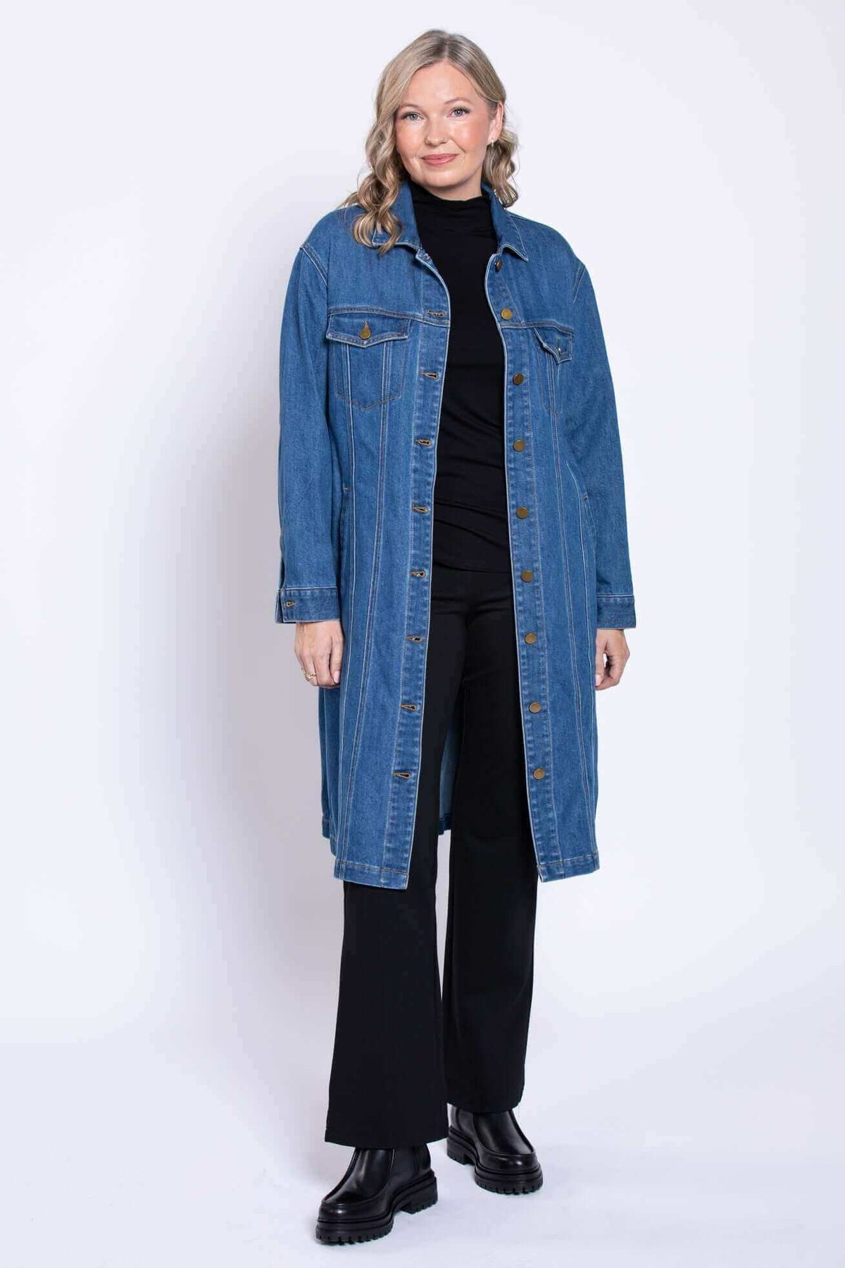 Full body straight pose of model in Geraldine longline denim jacket
