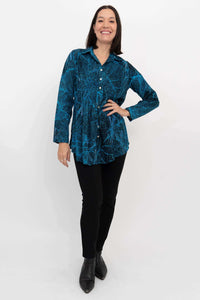 Full body view of model in blue leaf print Cindy shirt and black pants