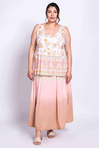 Full body view of model in Kaya Floral Tank Top paired with a long pink skirt