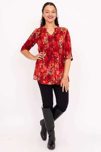 Full body view of Margate blouse in red floral, model standing and smiling