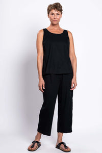 Full body front view of model in black sleeveless Ferris tank and pants