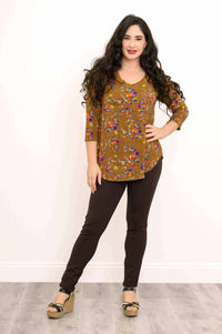Full body view of model in Jackie V-Neck floral top and dark pants
