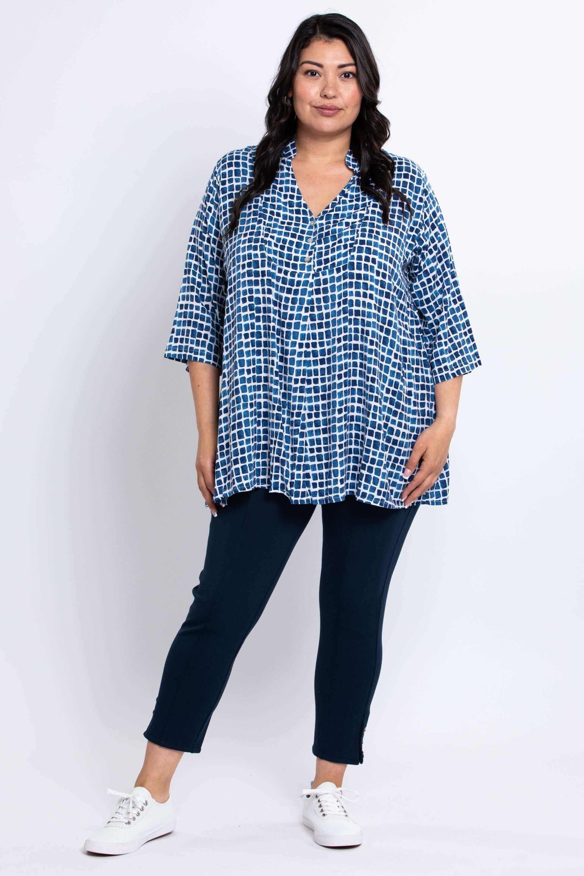 Full body view of model in blue batik Shirley blouse and navy pants