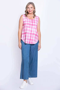 Full body view of woman in pink plaid tank top and wide-leg jeans